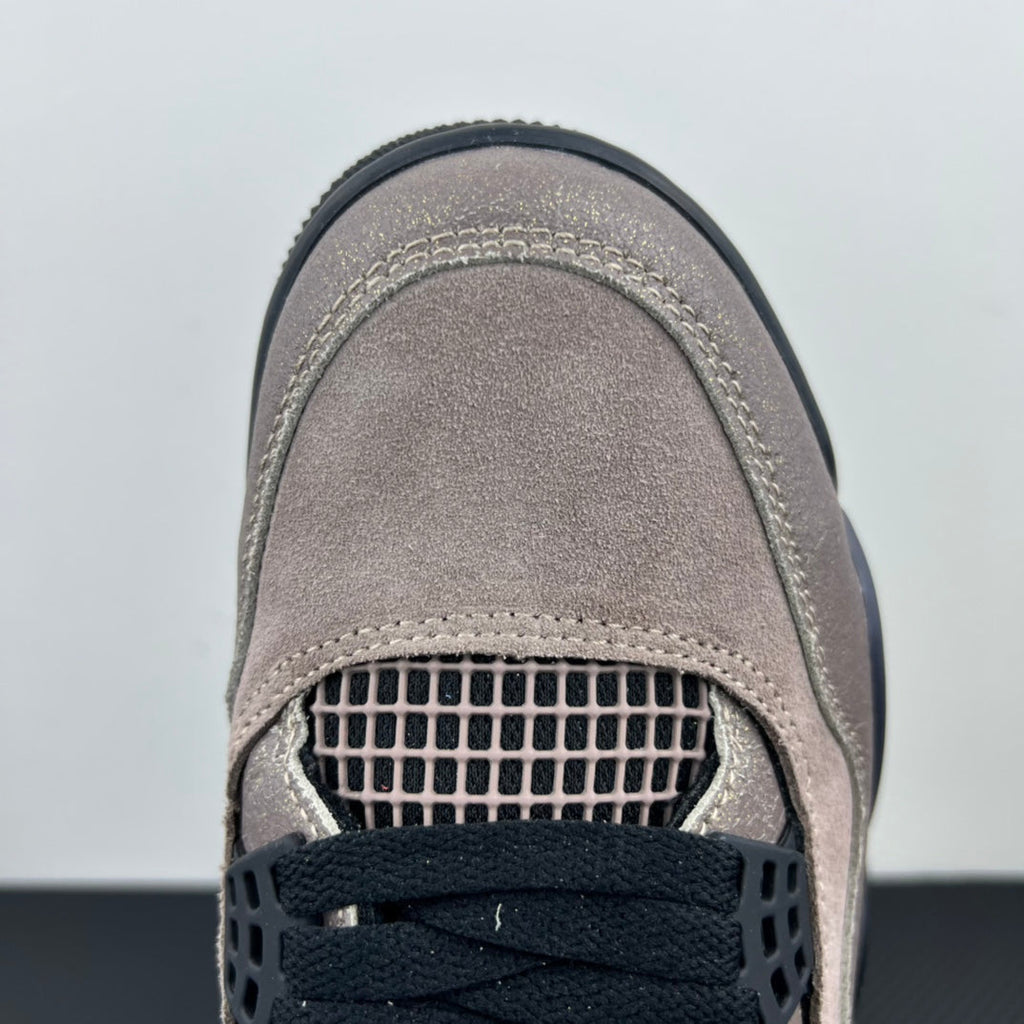 Taupe sneaker toe and side panel detail with perforated mesh window and stitching