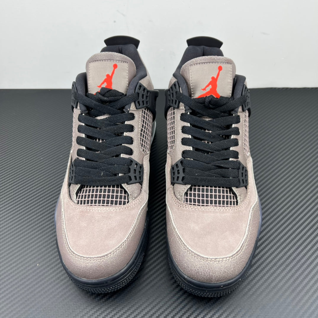 Pair of taupe suede Air Jordan 4 sneakers with black laces and mesh window