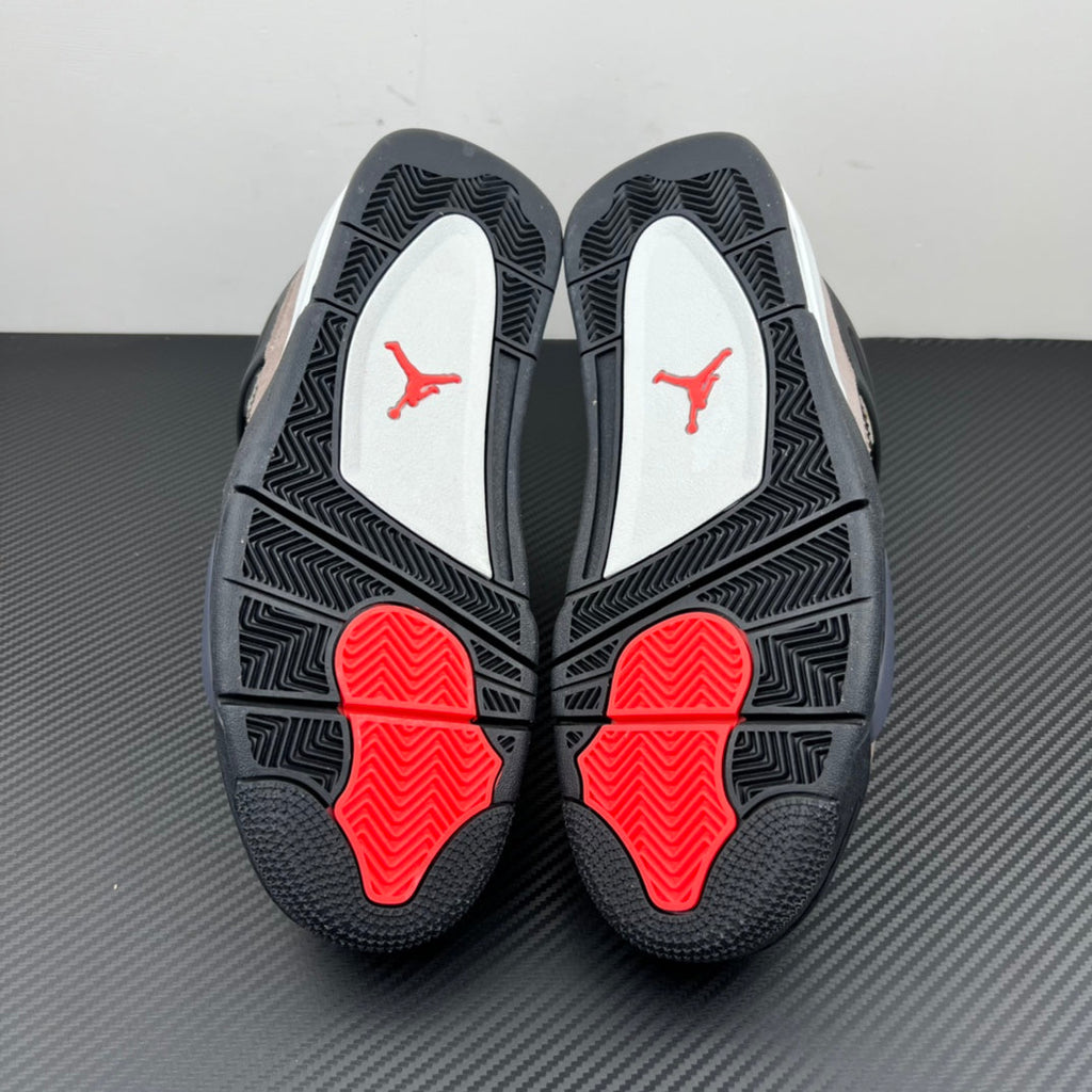 Air Jordan 4 outsole with black rubber tread and red traction pods