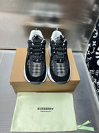 Pair of black lace-up sneakers with check fabric detail and white trim