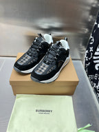 Black lace-up sneakers with check-textile side panels and white rubber soles