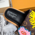 Louis Vuitton slide sandal footbed with script logo and embroidered yellow patch on strap