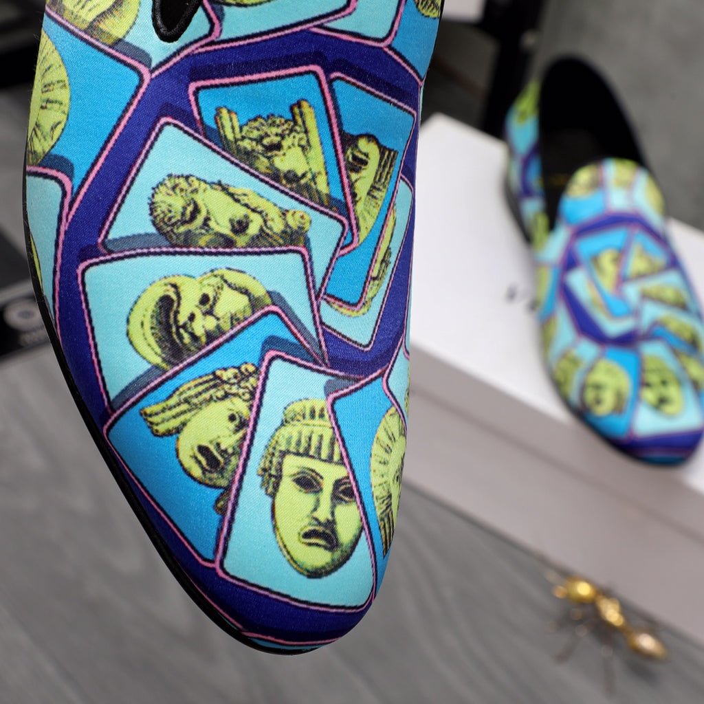 Close-up of Versace printed slip-on upper with blue background and yellow faces