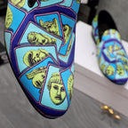 Close-up of Versace printed slip-on upper with blue background and yellow faces