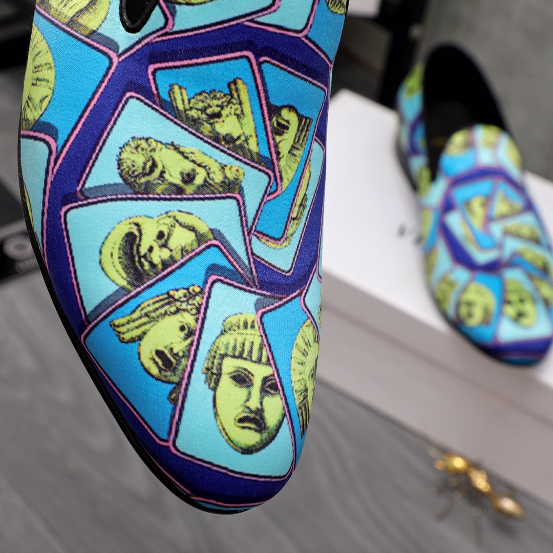 Close-up of Versace printed slip-on upper with blue background and yellow faces