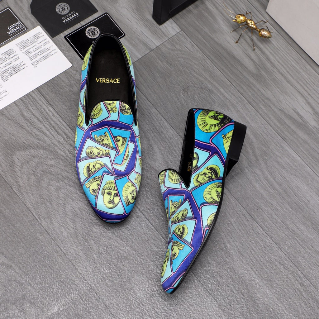 Versace printed slip-on shoes, blue upper with yellow face collage, black heels