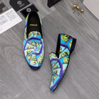 Versace printed slip-on shoes, blue upper with yellow face collage, black heels