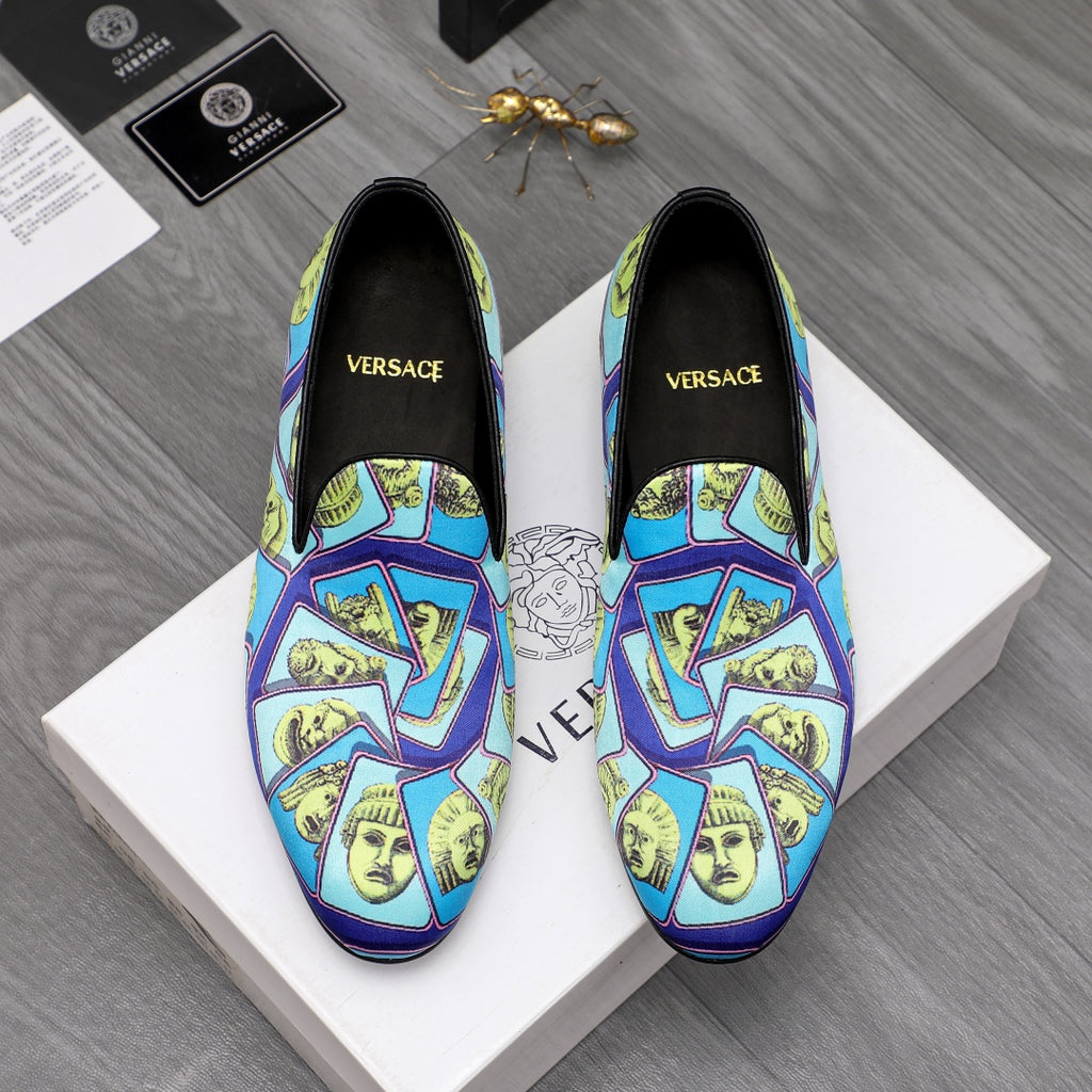 Versace printed slip-on shoes with blue upper and yellow graphic face pattern