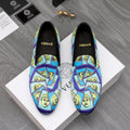 Versace printed slip-on shoes with blue upper and yellow graphic face pattern