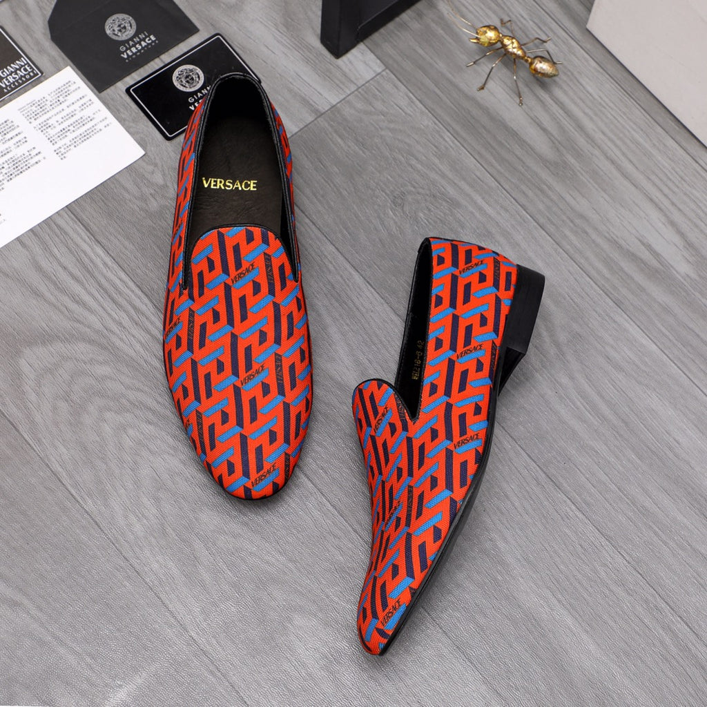 Versace luxury slip-on shoes, orange-blue geometric pattern, black back panel
