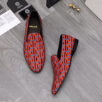 Versace luxury slip-on shoes, orange-blue geometric pattern, black back panel