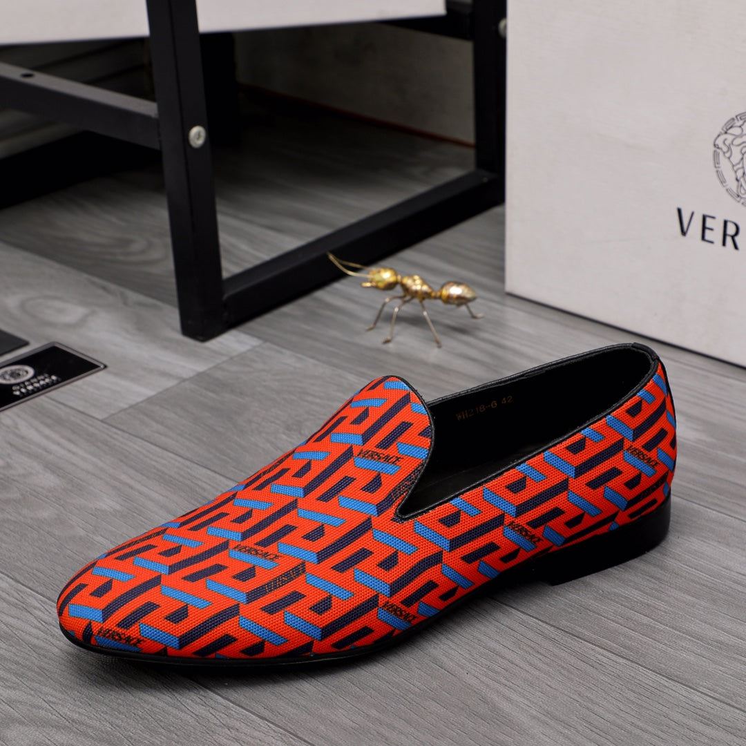 Versace luxury slip-on shoes, orange-blue geometric pattern, black outsole