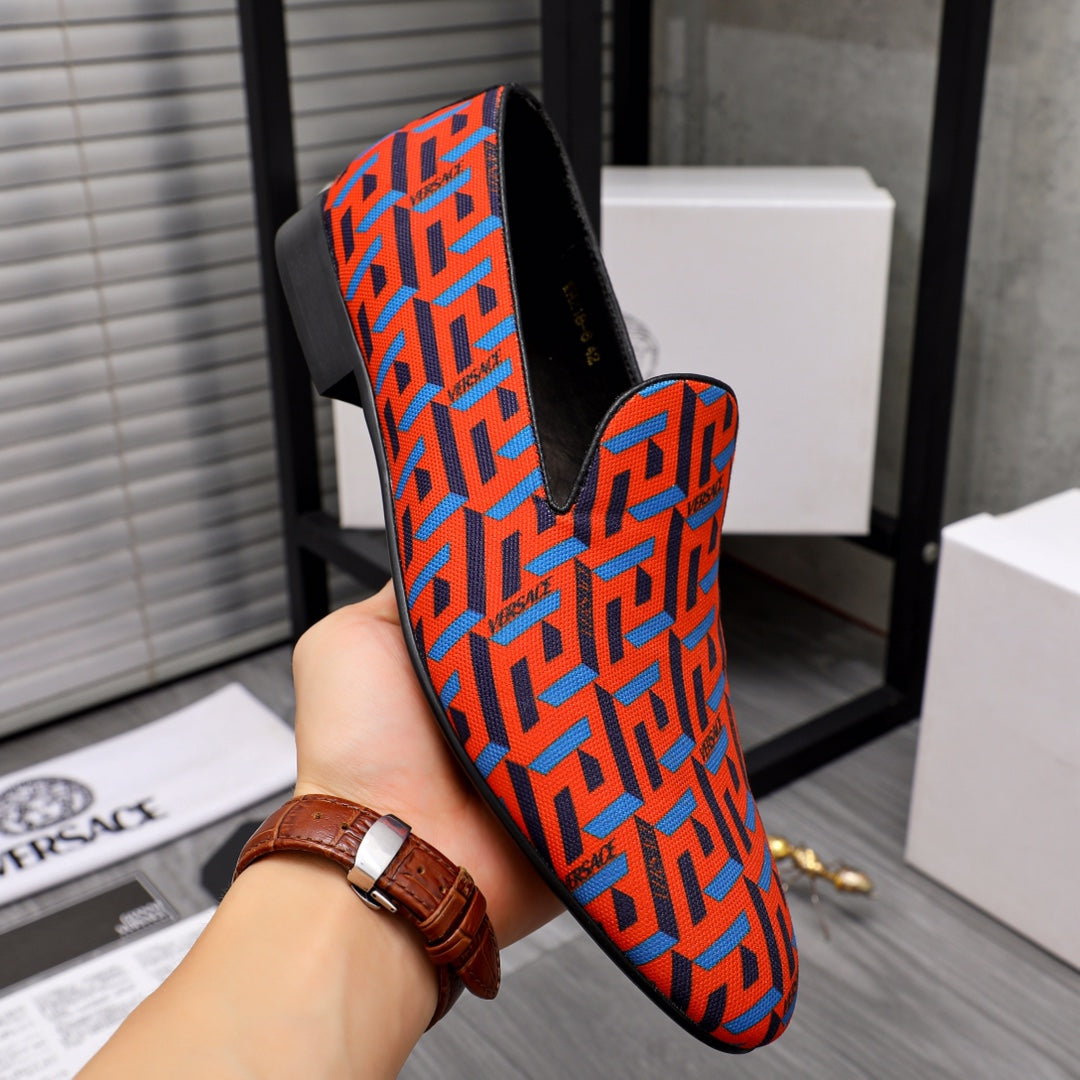 Versace luxury slip-on shoes, orange and blue geometric pattern, black heel