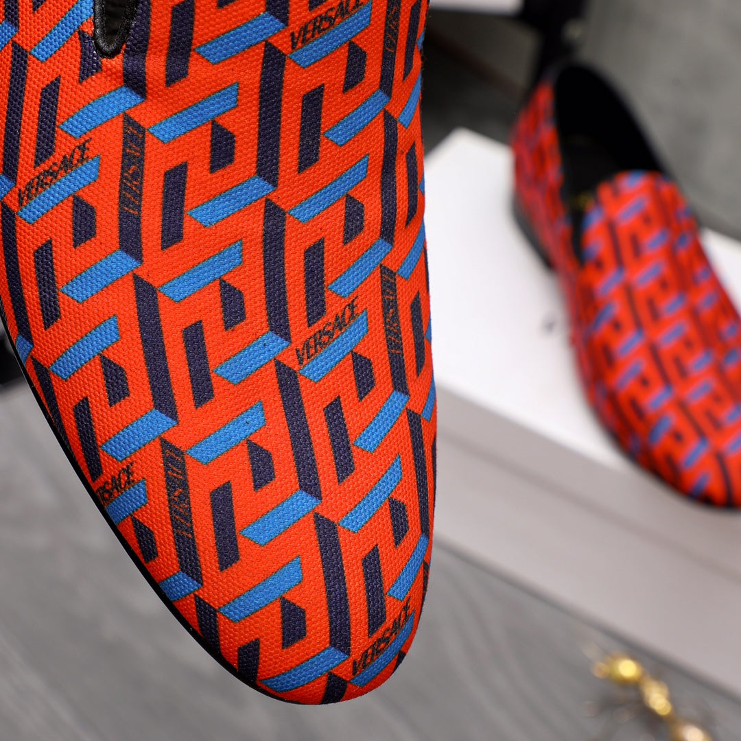 Versace luxury shoe upper, orange-blue geometric logo pattern