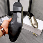 Rear view of rhinestone loafer with black heel panel and molded logo