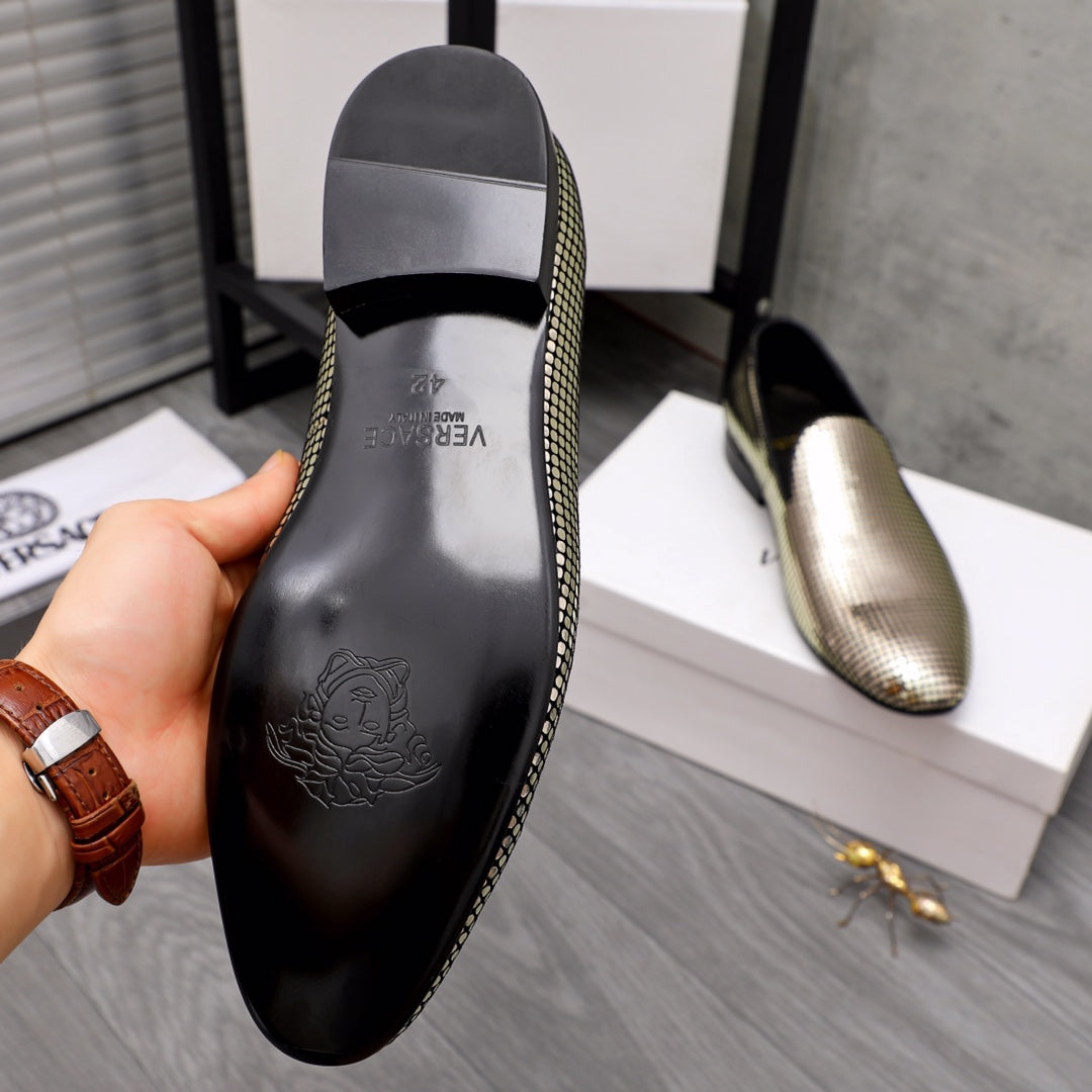 Rear view of rhinestone loafer with black heel panel and molded logo