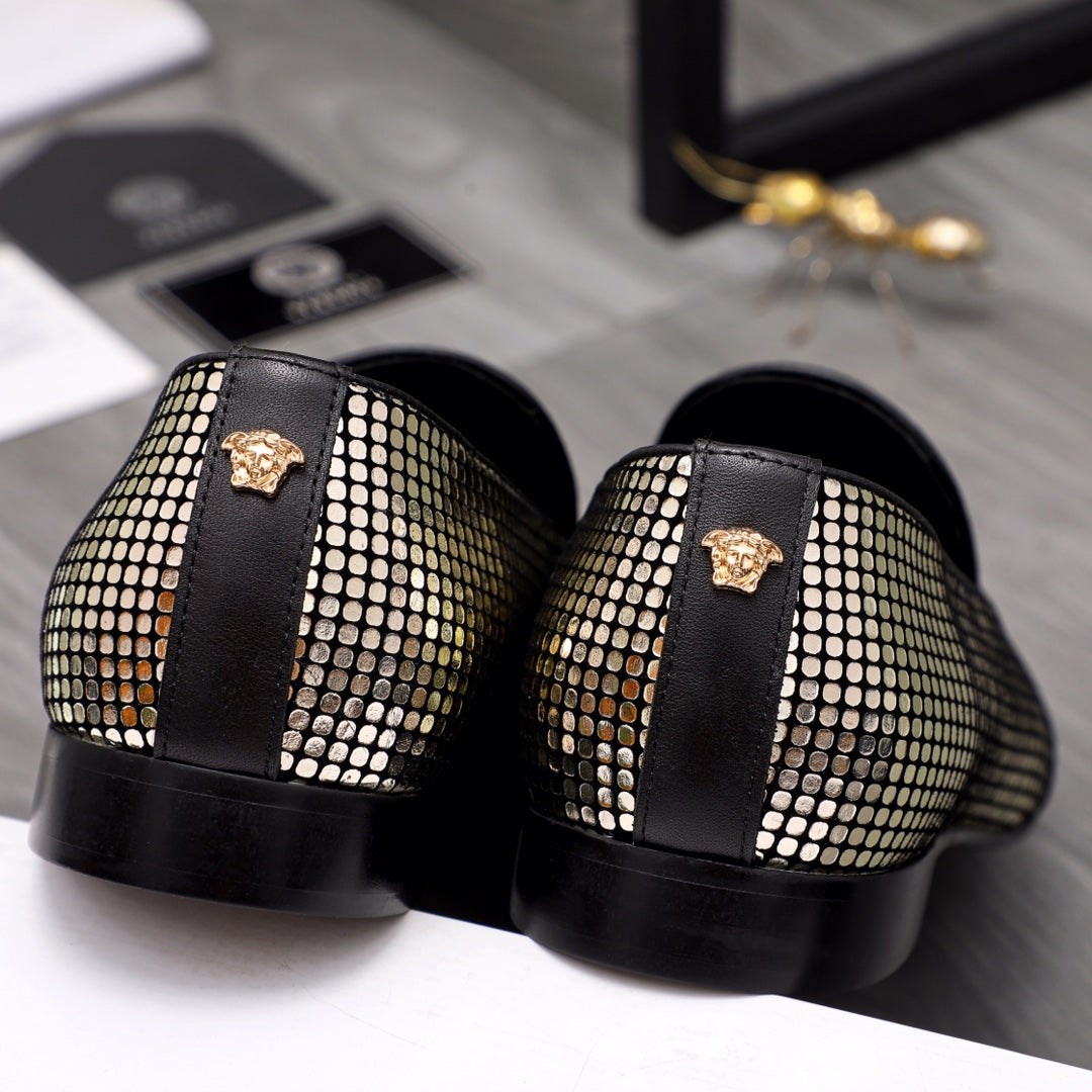 Back view of black and gold rhinestone loafers with medallion and chunky sole
