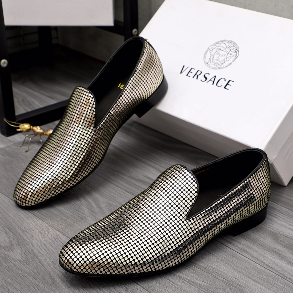 Gold and white rhinestone loafer pair with black interior and flat sole
