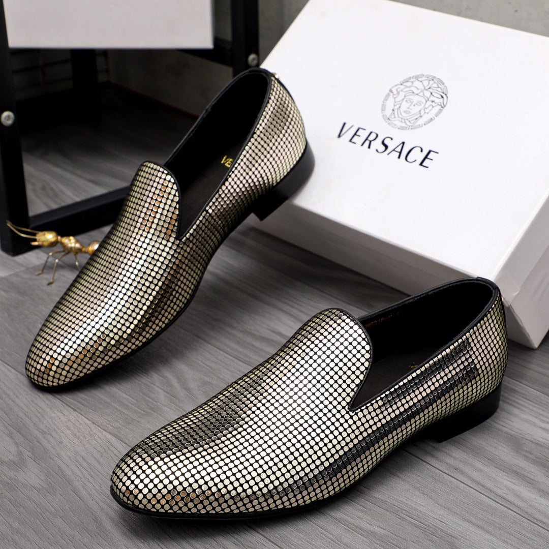 Gold and white rhinestone loafer pair with black interior and flat sole