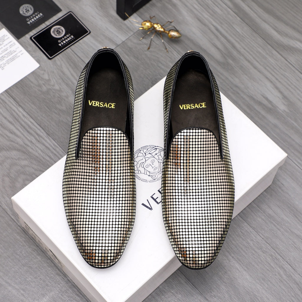 Rhinestone slip-on loafers with gold and white sparkle and black trim, pair shown