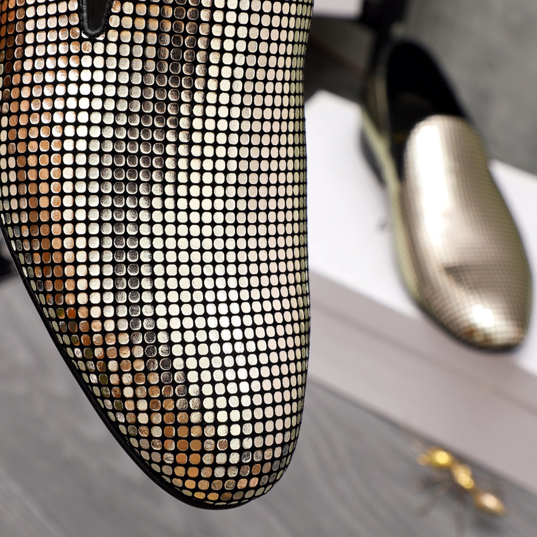 Close-up of gold and white rhinestone pattern on slip-on loafer upper