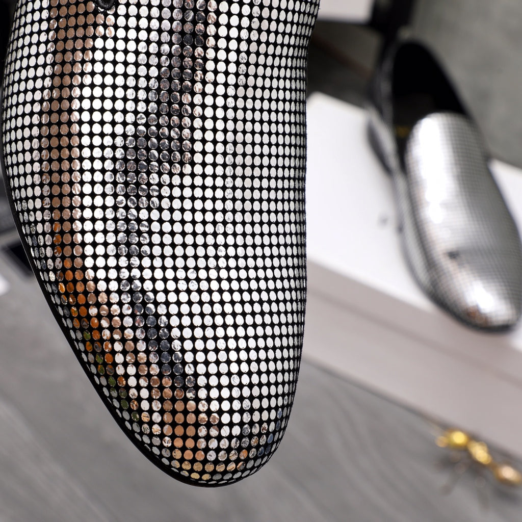 Close-up rhinestone mesh upper on a black pointed loafer