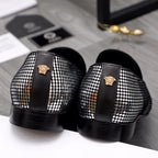Back view rhinestone loafers with black heel, gold emblem on strap