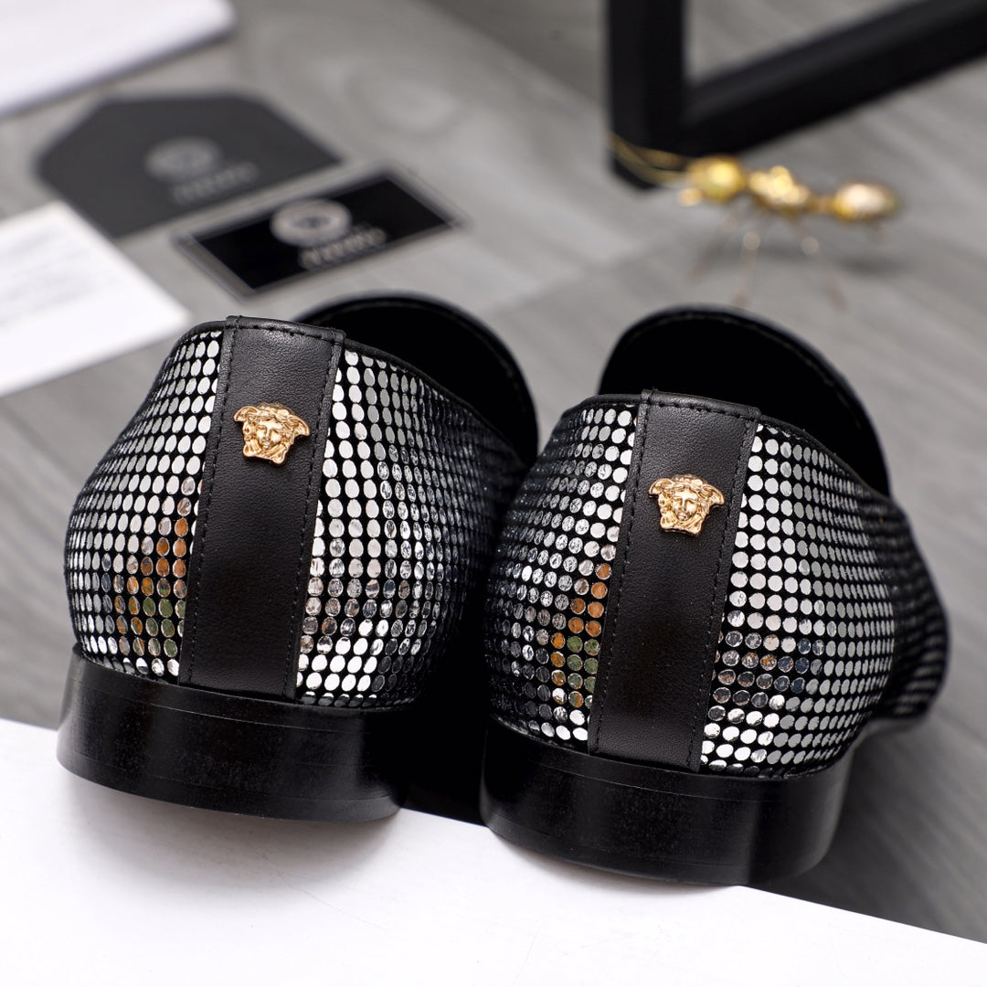 Back view rhinestone loafers with black heel, gold emblem on strap