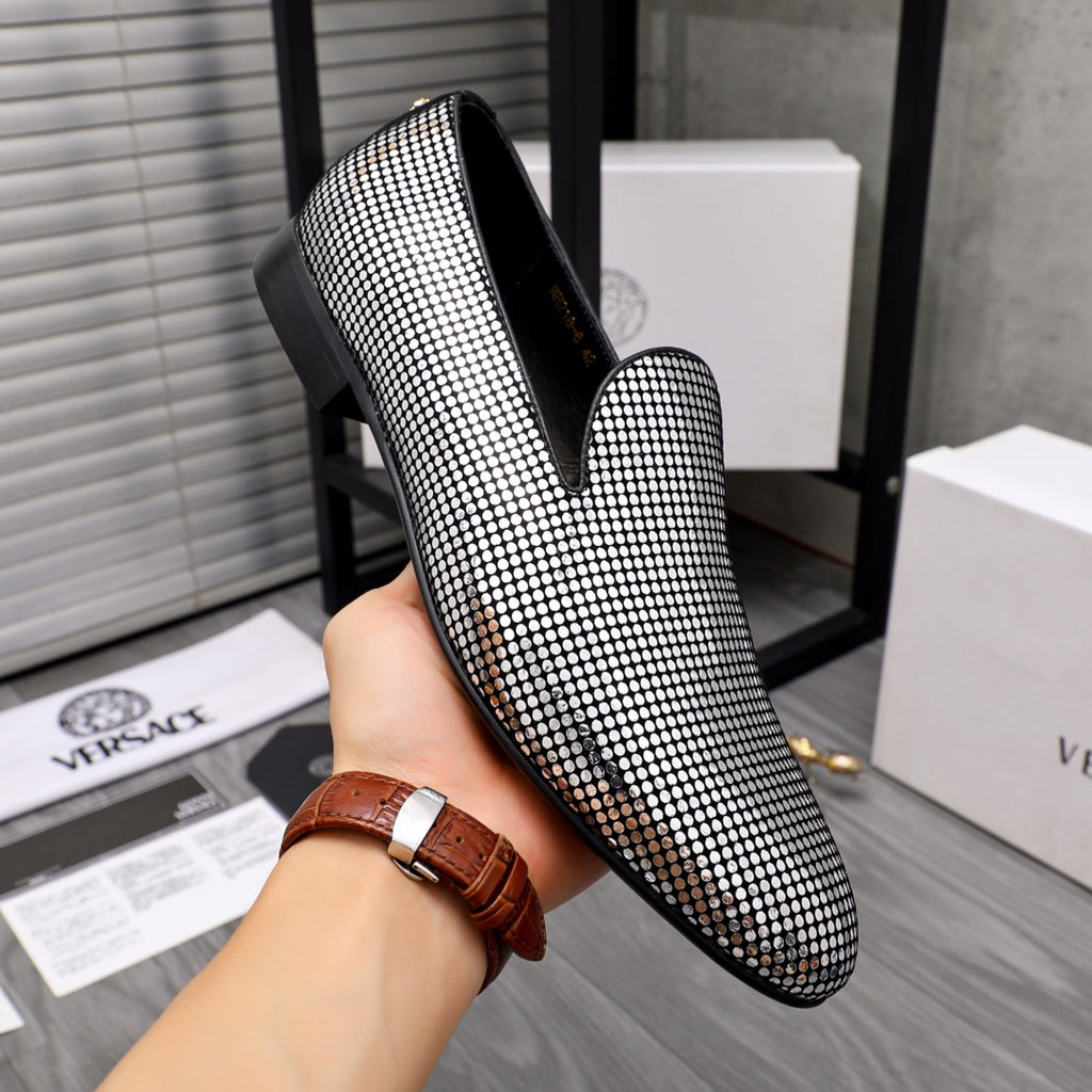 Rhinestone loafer with pointed toe and black slip-on opening, gold emblem detail