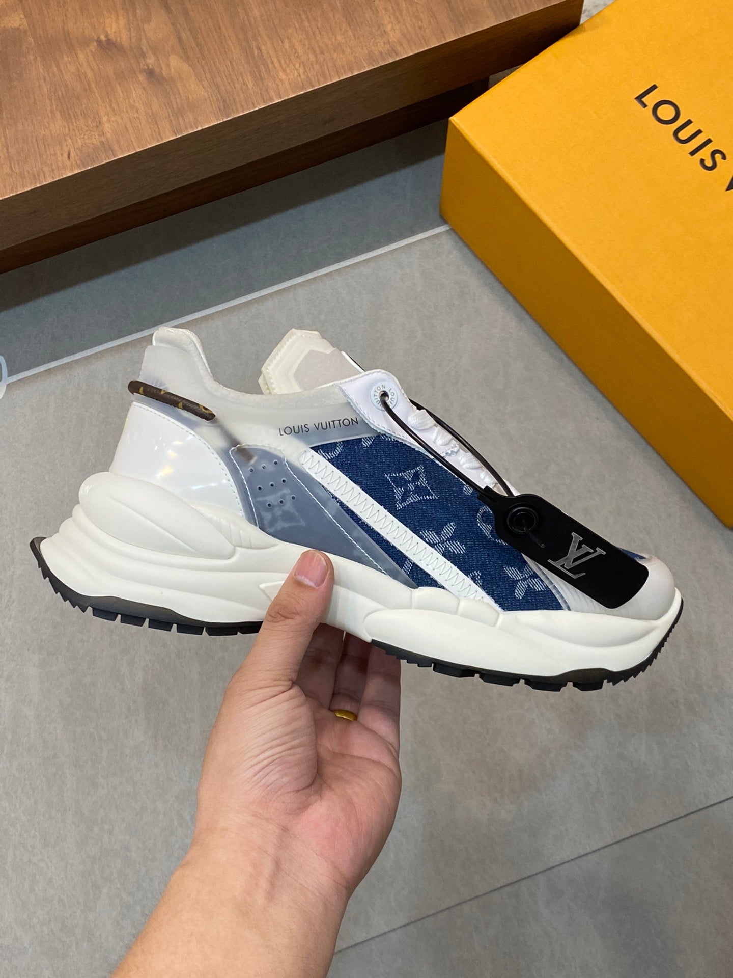 Blue-and-white monogram unisex sneaker, side view, chunky rubber sole