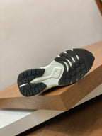 Unisex sneaker outsole with black tread and light midsole