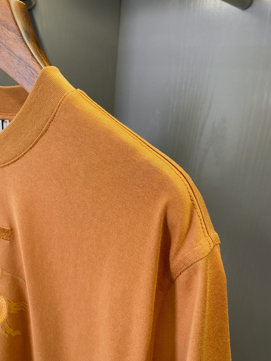 Burberry short-sleeve T-shirt, rust orange, stitched shoulder and textured knit