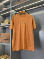 Burberry short-sleeve T-shirt in rust orange with chest logo graphic