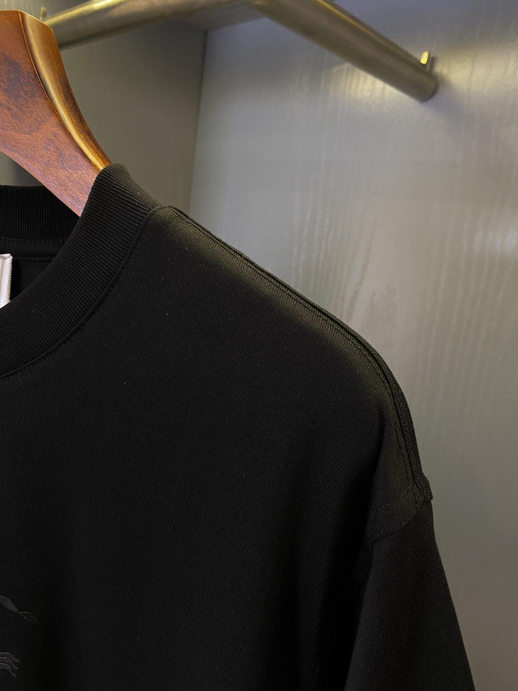 Black Burberry T-shirt sleeve and shoulder seam with ribbed cuff