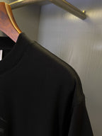 Black Burberry T-shirt sleeve and shoulder seam with ribbed cuff