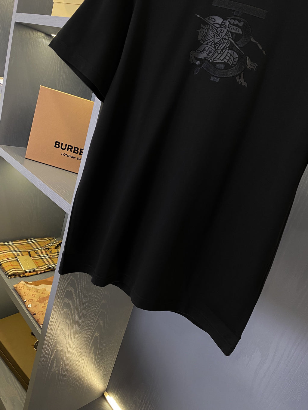 Black Burberry short-sleeve T-shirt with front graphic detail near the hem