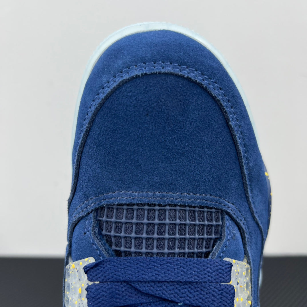 Air Jordan 4 toe close-up in blue suede with mesh panel and yellow speckled accents