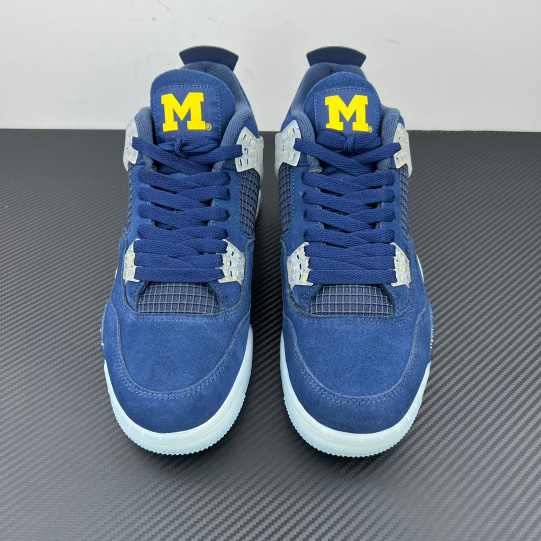 Air Jordan 4 sneaker pair with blue laces, white midsoles, and yellow “M” patches