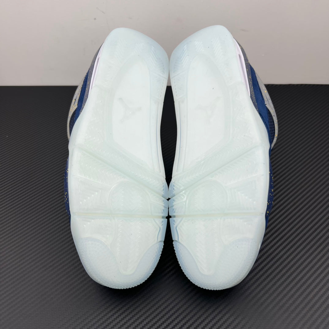 Air Jordan 4 sneaker outsole with white tread panels and blue edge trim
