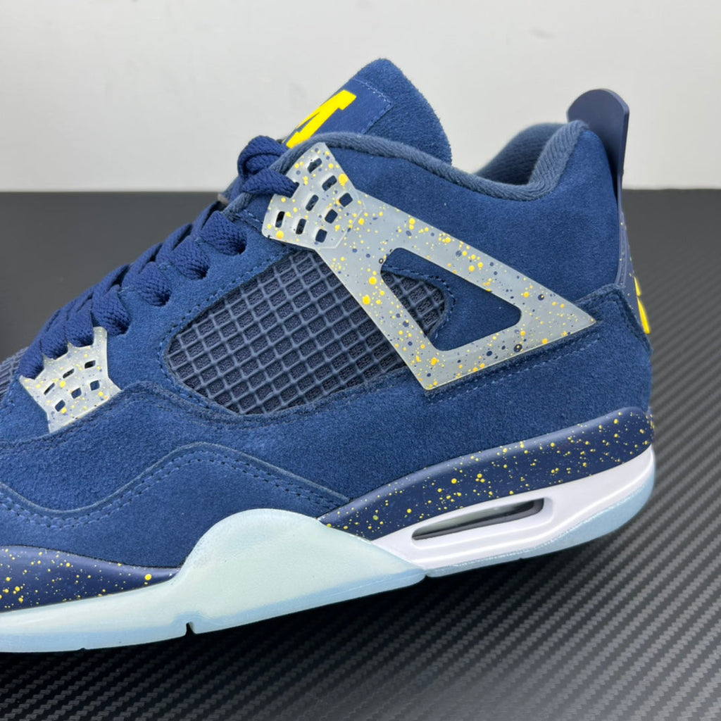 Air Jordan 4 sneaker close-up in blue with speckled detailing and Air sole window
