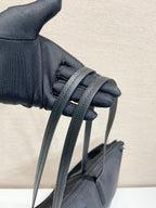 Prada nylon tote bag close-up of strap attachment with woven webbing