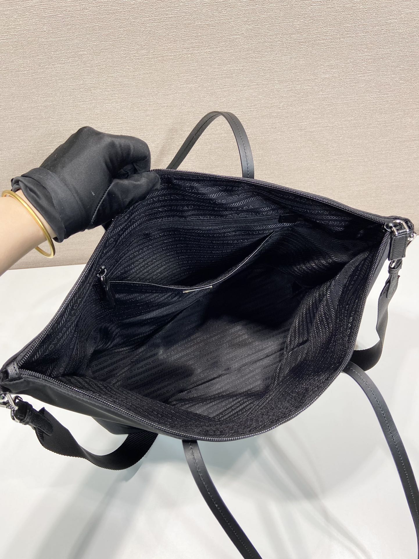 Prada nylon tote bag with open top showing dark interior lining
