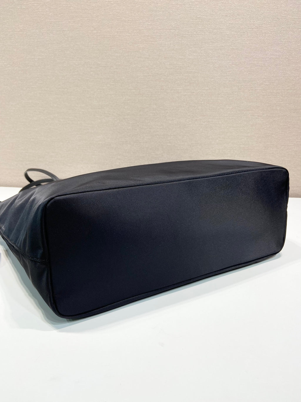 Prada nylon tote bag back view with smooth flat surface