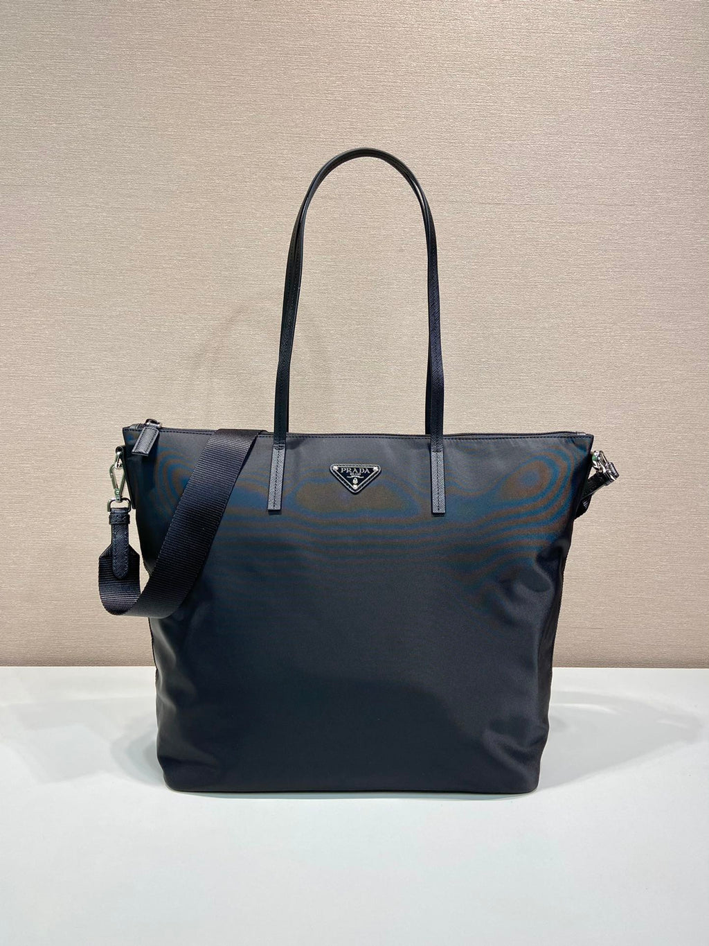 Prada nylon tote bag in dark navy, with top handles and side zip pockets