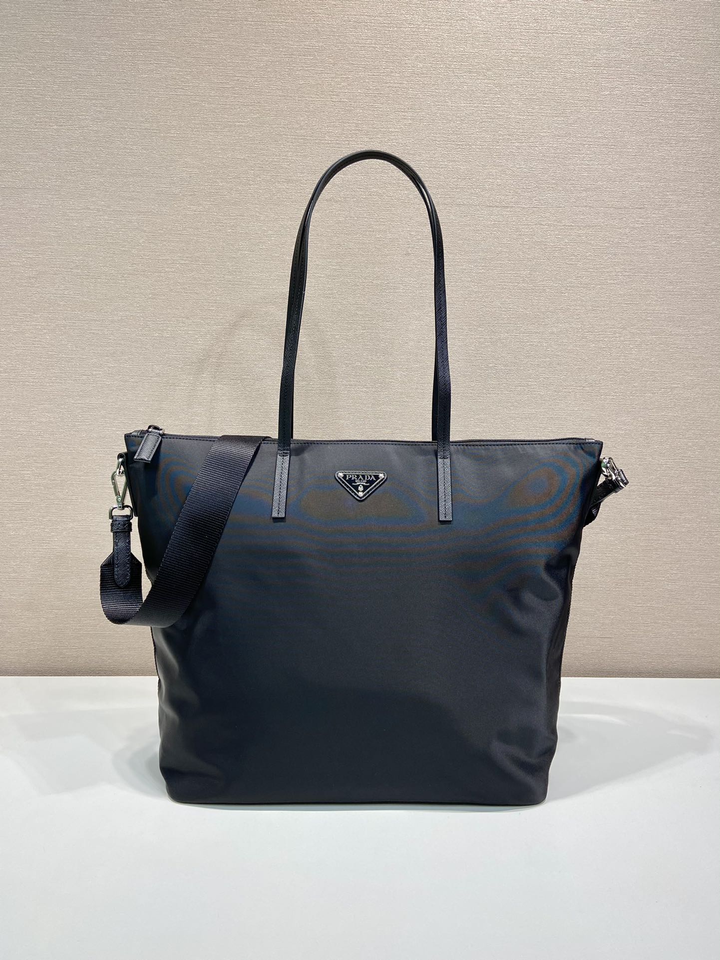 Prada nylon tote bag in dark navy, with top handles and side zip pockets