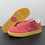 Low-top sneaker heel and outsole view, pink upper with gum-yellow traction sole