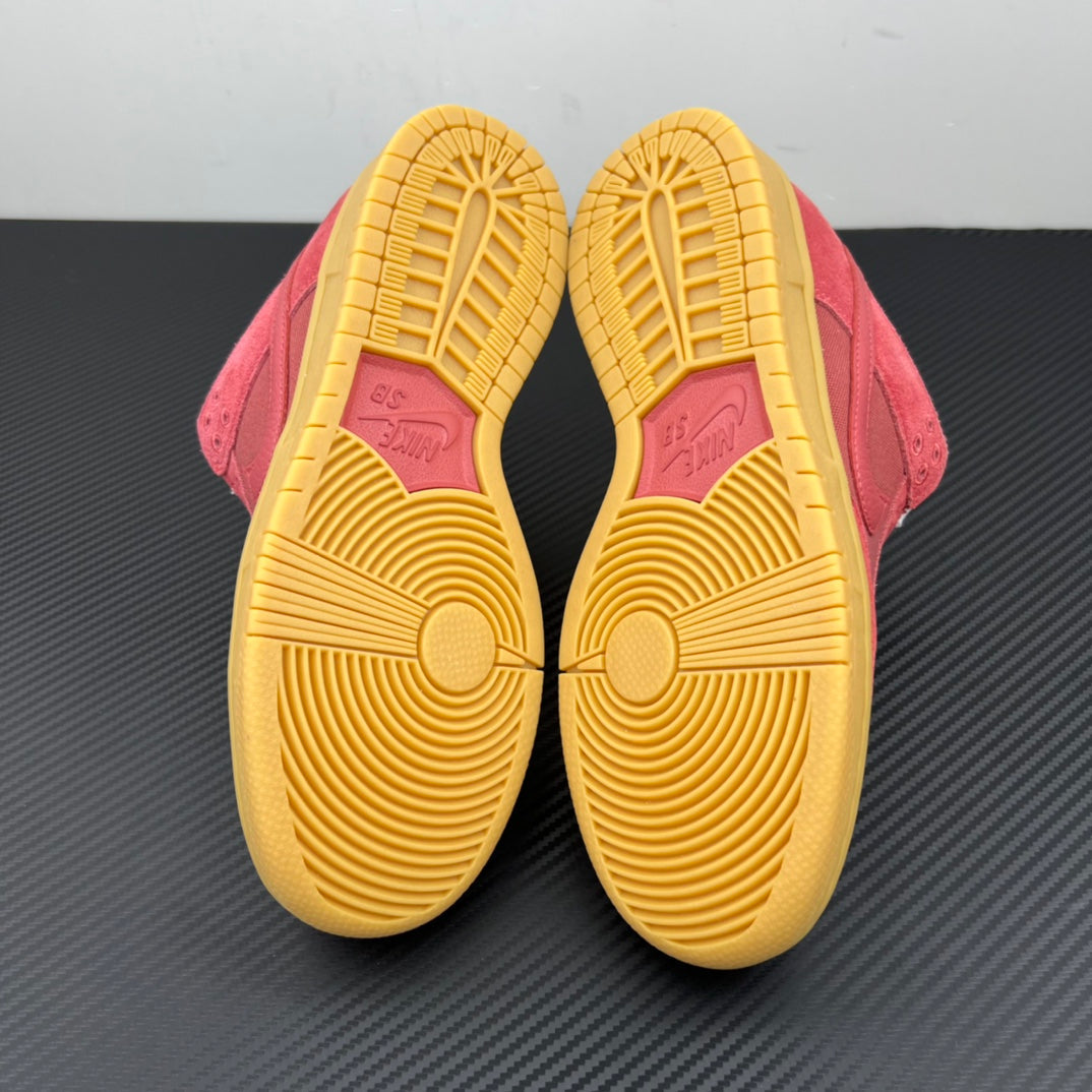 Low-top sneaker outsole view with yellow rubber tread and pink suede heel