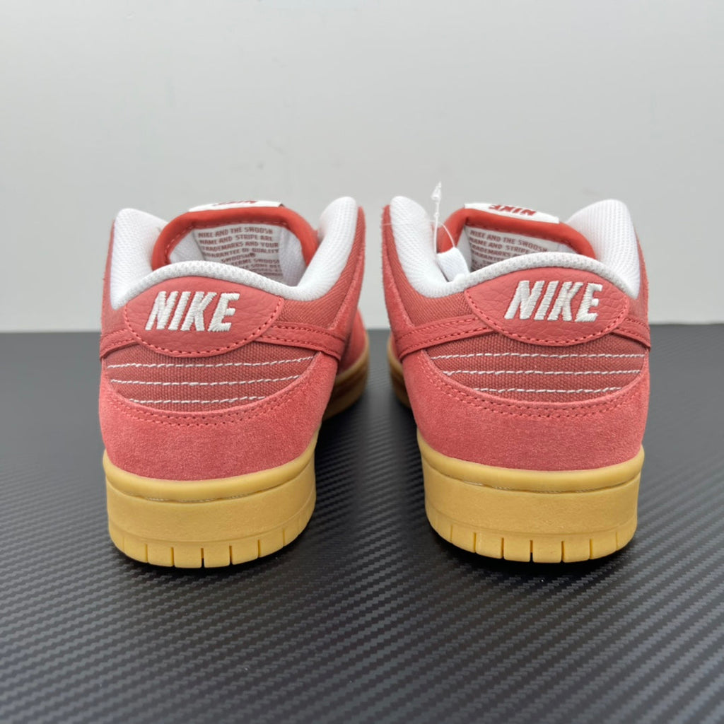 Low-top sneakers rear view in pink suede with white heel lining and yellow sole