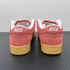 Low-top sneakers rear view in pink suede with white heel lining and yellow sole