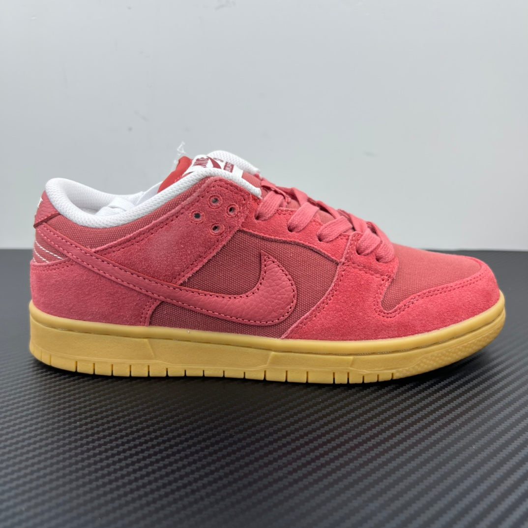 Low-top sneaker side view in pink suede with white laces and yellow sole